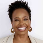 A headshot of Denise Greene against a neutral white background.