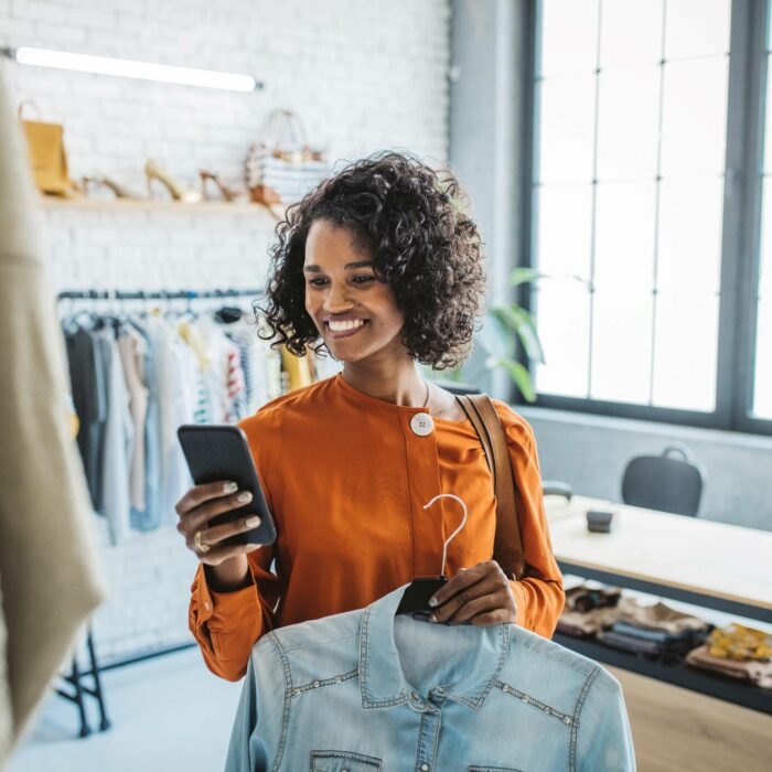 black woman shopping at thrift store