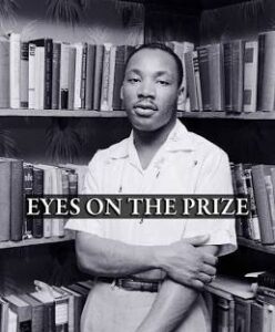 mlk standing in a library